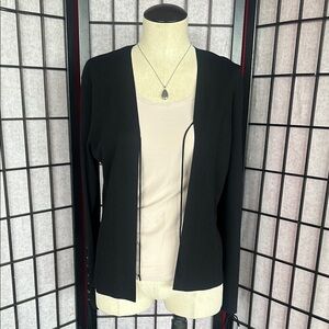 Cool black cardigan with lace-up feature on sleeves.
